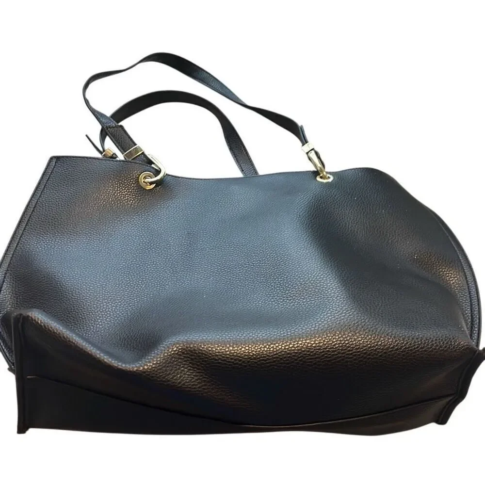 Steve  Madden Black tote, small flaw on top above nameplate